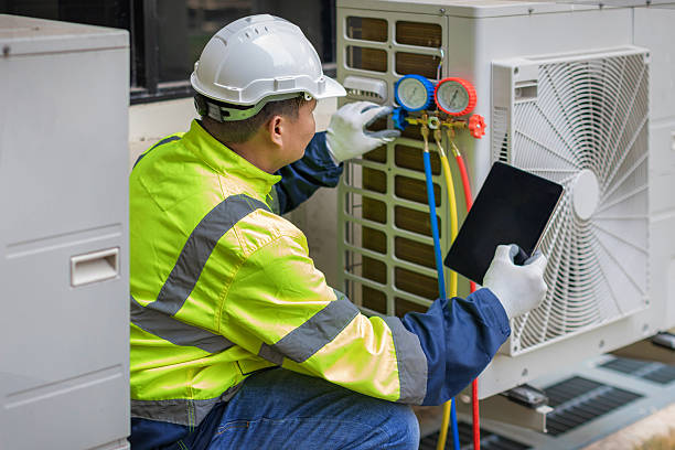 Professional Air Conditioning Repair technician working in Oak Island, NC